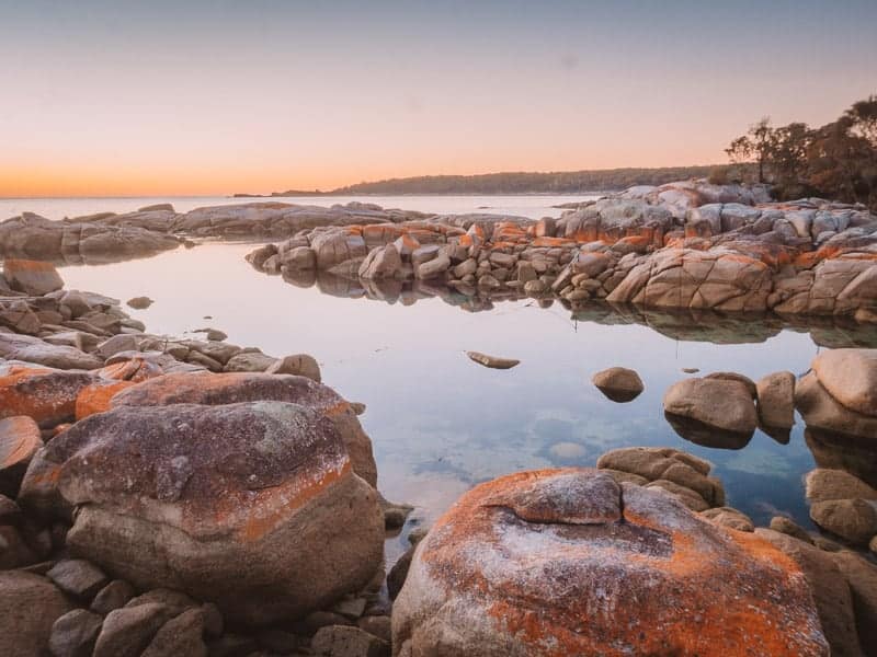 Iconic orange rocks at the Bay of Fires in Tasmania, Australia